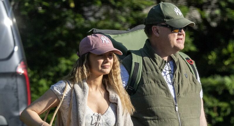 Mr Tumble, 55, arrives at hotel with co-star girlfriend, 34, 