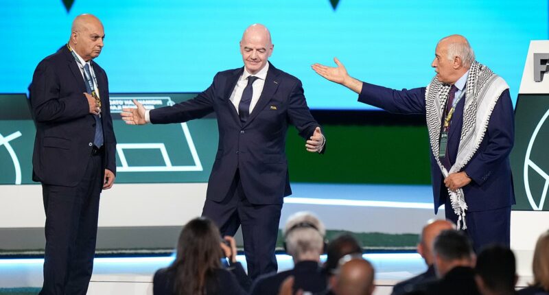 Remarkable moment FIFA's blundering president Gianni Infantino tries - and fails - to get Israel and Palestine football chiefs to shake hands on stage
