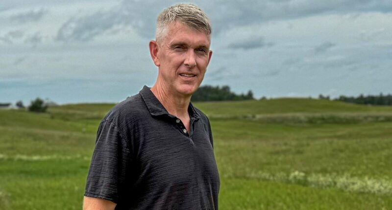 Rural Minnesota town being torn apart over plans for green burial site as landowner claims he is being intimidated by guns and drones