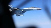 A handout picture released by UK's Ministry of Defence (MOD) in London on May 20, 2026 shows Image of a Russian Su-35, seen here alongside an RAF Rivet Joint aircraft over the Black Sea in April 2026.