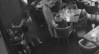 Surveillance video showing a man and women stealing a bottle of liquor