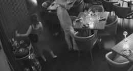 Surveillance video showing a man and women stealing a bottle of liquor