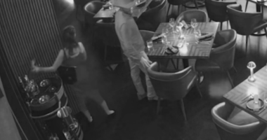 Surveillance video showing a man and women stealing a bottle of liquor