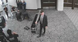 Surveillance footage shows gunman charging through officers