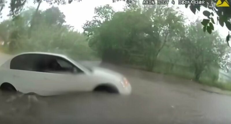 Video shows infant being rescued from car trapped in Texas floodwaters