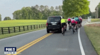GIF of SUV hitting cyclist