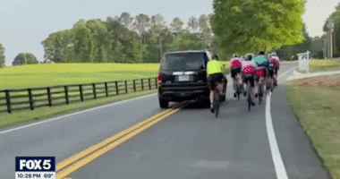 GIF of SUV hitting cyclist