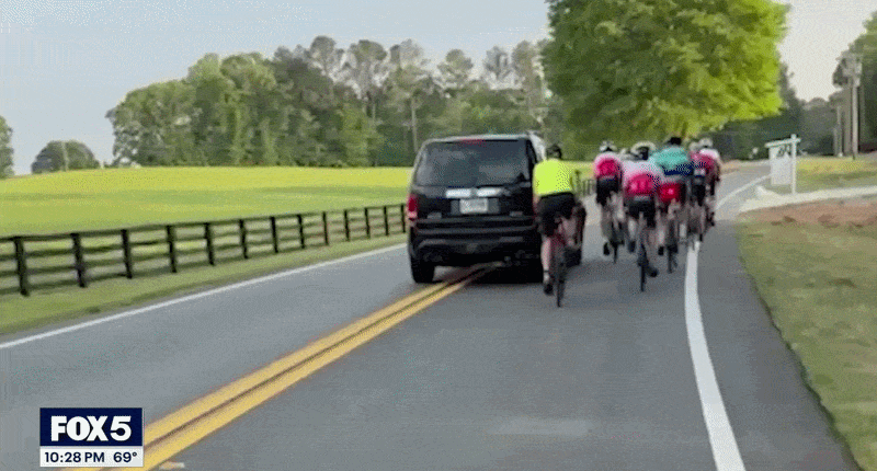 GIF of SUV hitting cyclist