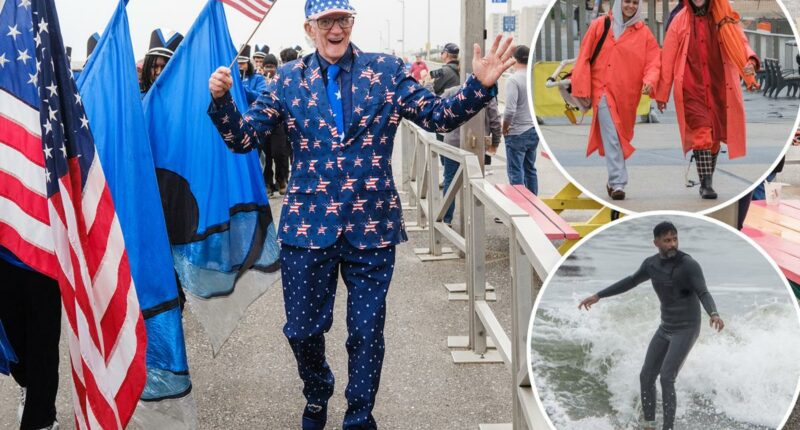 Wet Memorial Day scares off NYC beach crowds -- but diehard locals stick it out