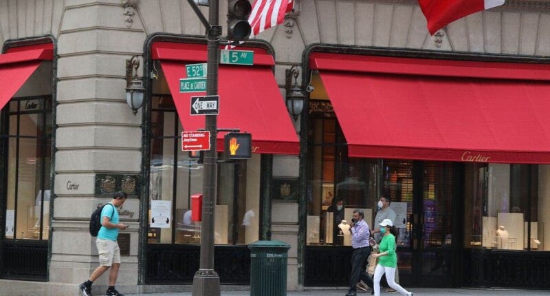Woman dies after plunging into uncovered manhole outside luxury stores