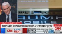 Anderson Cooper cracks up live on CNN while discussing Trump-branded merchandise including golden phone, $12,000 coins, sneakers and Bible: 'Where does he find the time?'