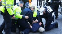 Anti-immigrant protesters clash with counter-demonstrators across UK