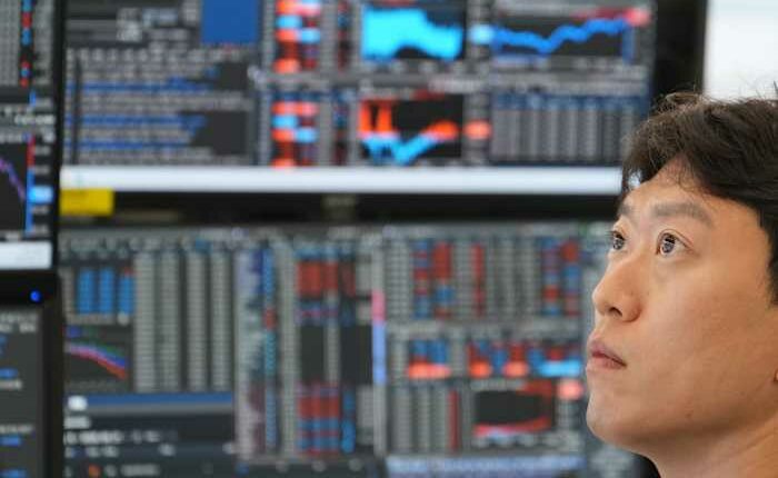 Asian shares are mostly higher and Japan's Nikkei tops 70,000 before BOJ rate hike