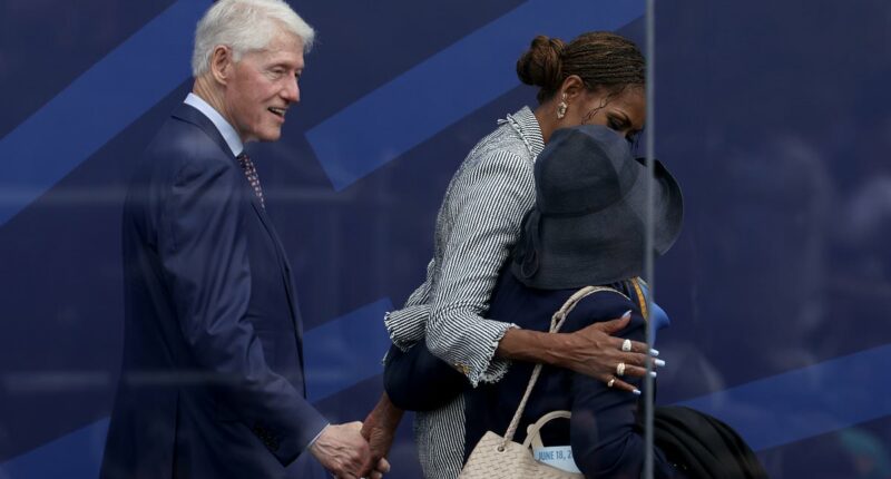 Bill Clinton's VERY cozy moment with Michelle