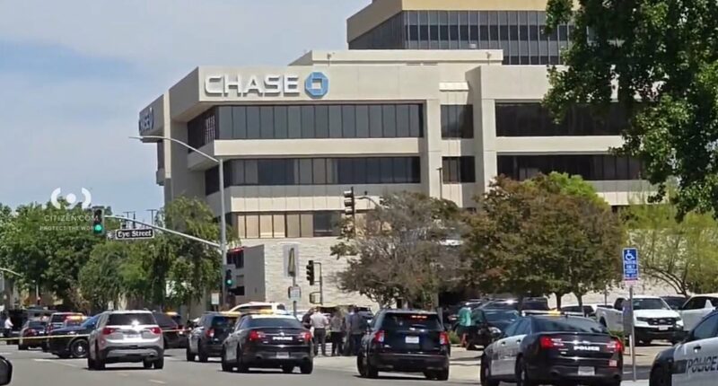 Hostage situation unfolds with robber with 'bomb' strapped to chest