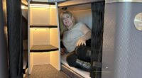 Lee Cobaj pictured inside a SkyNest 'bottom' bunk at the the IMM TRENZ travel industry conference in Auckland, New Zealand