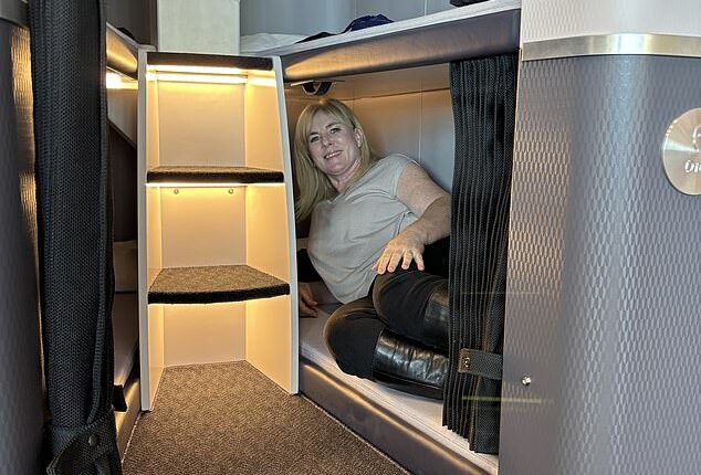 Lee Cobaj pictured inside a SkyNest 'bottom' bunk at the the IMM TRENZ travel industry conference in Auckland, New Zealand