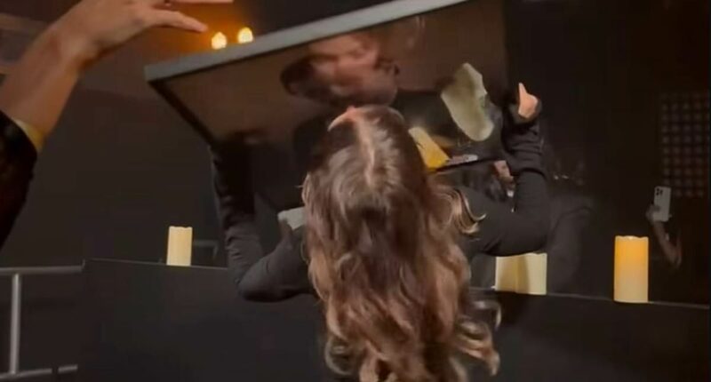 Jake Hall's ex Chloe Lewis kisses a picture of late star at funeral