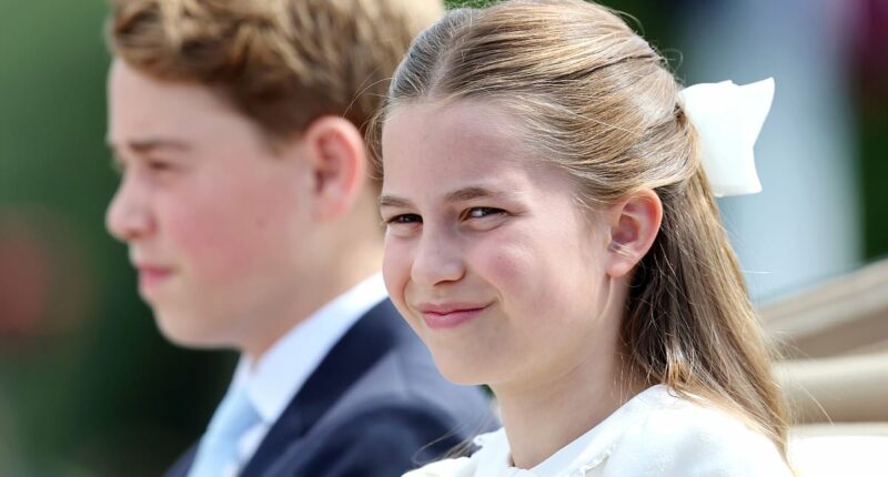 Kate's mini-me! Princess Charlotte, 11, matches her mother in a white and blue dress as they travel together during the King's birthday parade