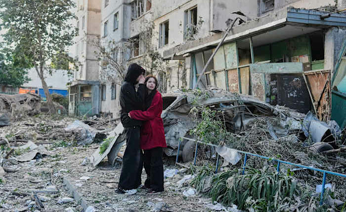 Russian attack on Ukraine capital kills at least 3 and traps others in damaged buildings