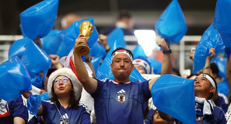 The REAL heroes of the World Cup: Classy Japan fans clean up after themselves following draw against the Netherlands