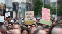 Thousands rally in Belfast to condemn anti-immigrant rioting that followed stabbing