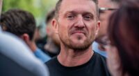 Tommy Robinson detained at Heathrow under terrorism act