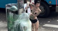 NYC dominatrix plastic wraps sub to pole and douses him in milk