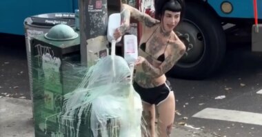 NYC dominatrix plastic wraps sub to pole and douses him in milk