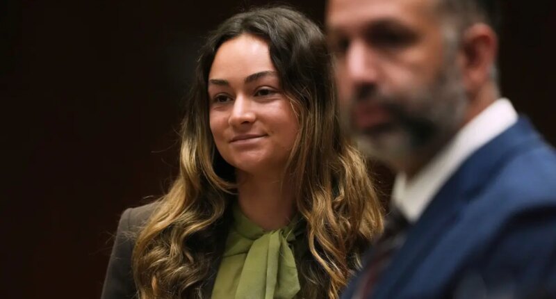 TikTok influencer flashes sinister smirk in court after alleged plot to kill boyband member