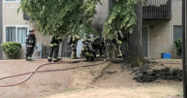 Animated video shows firefighters opening an electrical room door before an explosion sends flames and debris outward at a Tacoma apartment complex.