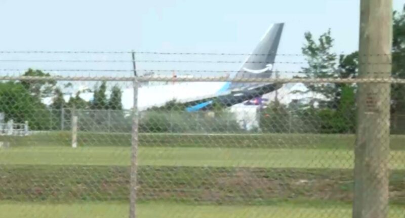 Amazon cargo plane overruns Miami airport runway, striking 'multiple' vehicles and catching fire