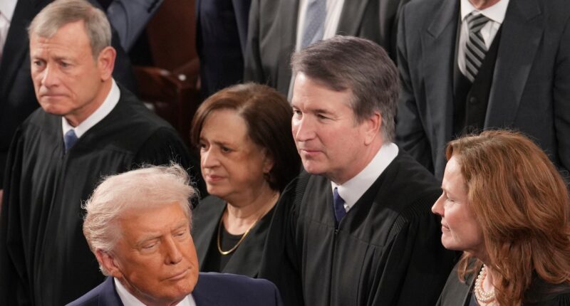 President Donald Trump walks past Chief Justice John Roberts at State of the Union.