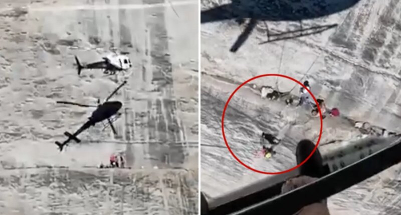 Harrowing moment helicopter hovers frighteningly close to cliff face to rescue fallen climber