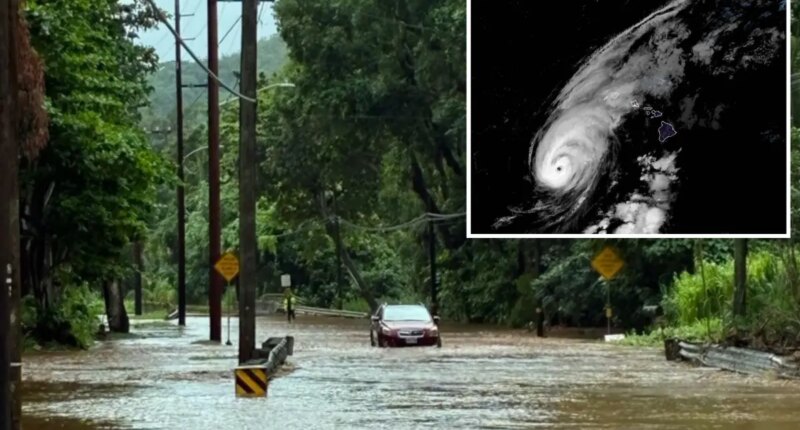 Life-threatening Hurricane Lowell makes direct hit on Hawaii as intense rain, wind blast state