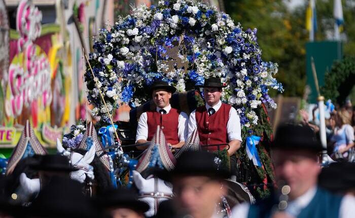 Munich’s Oktoberfest roars to life as the mayor taps the first keg