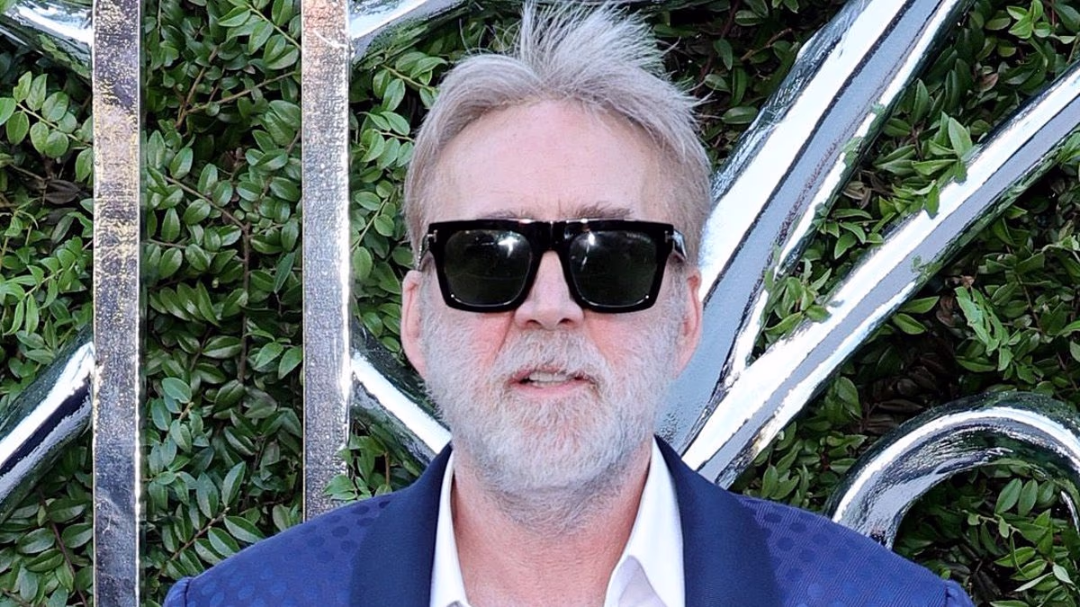 Nicolas Cage is unrecognizable with gray hair and beard on red carpet