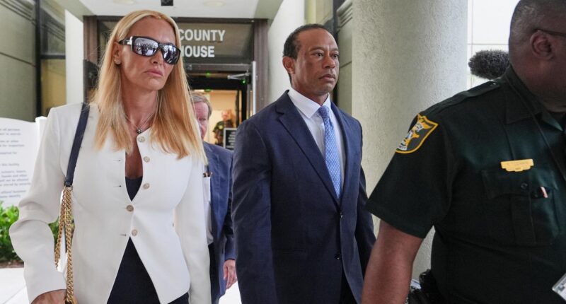 Golfer Tiger Woods leaves with Vanessa Trump after Woods