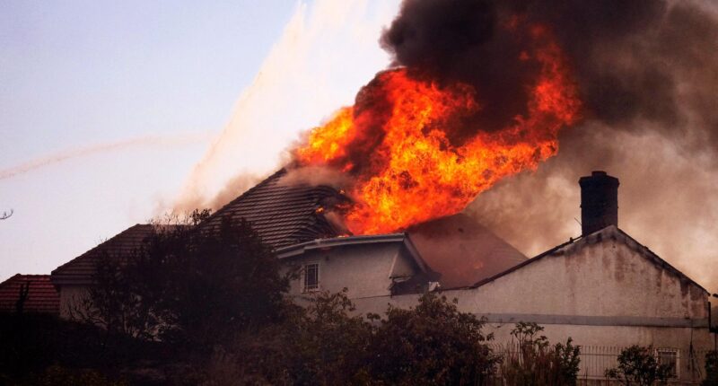 Coastal homes burn as hot winds fuel California fires