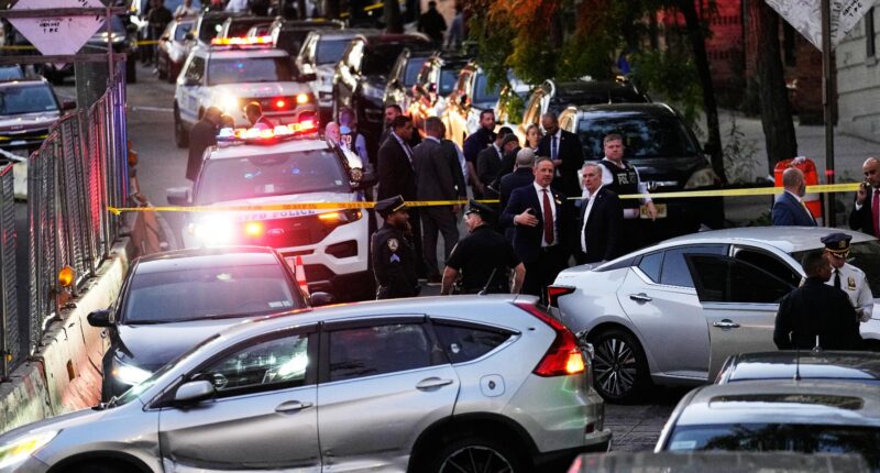 Law enforcement work the scene of a shooting Thursday, Oct. 8, 2026, in New York. (AP Photo/Seth Wenig)