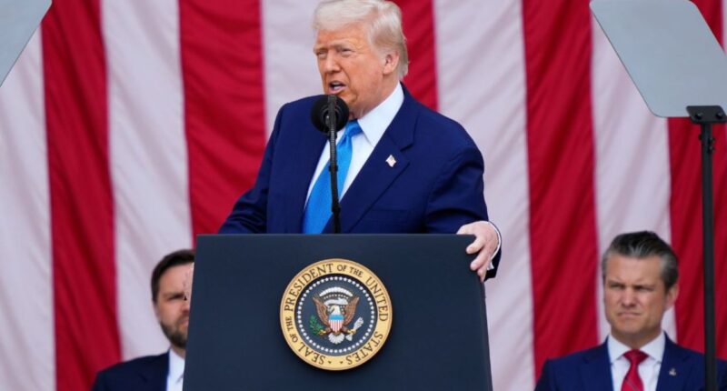 President Donald Trump delivers the Memorial Day Address at the 157th National Memorial Day Observance at Arlington National Cemetery, Monday, May 26, 2025, in Arlington, Va., as Vice President JD Vance and Secretary of Defense Pete Hegseth, right, look on (AP Photo/Julia Demaree Nikhinson).