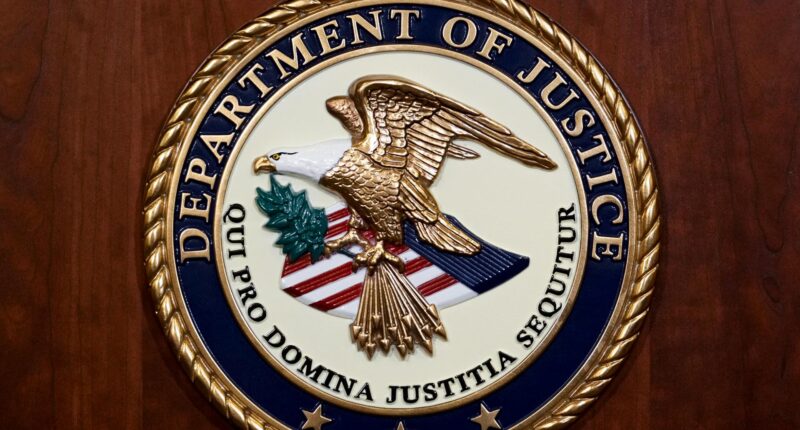 The seal of the Department of Justice, Aug. 1, 2023, at the Department of Justice in Washington. (AP Photo/J. Scott Applewhite, File)