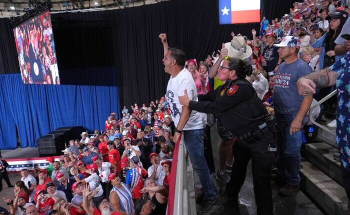 Trump interrupted by protesters as he fights to rally Texas voters behind Paxton in US Senate race