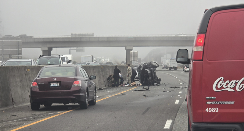 Woman allegedly stabs girl after SUV hits semi as soldiers step in to stop horrific roadside attack
