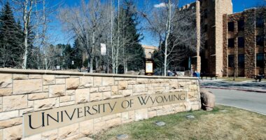 FILE - The University of Wyoming campus sign is seen with the Wyoming Union in the background on March 23, 2012 in Laramie, Wyo.
