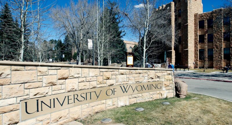 FILE - The University of Wyoming campus sign is seen with the Wyoming Union in the background on March 23, 2012 in Laramie, Wyo.